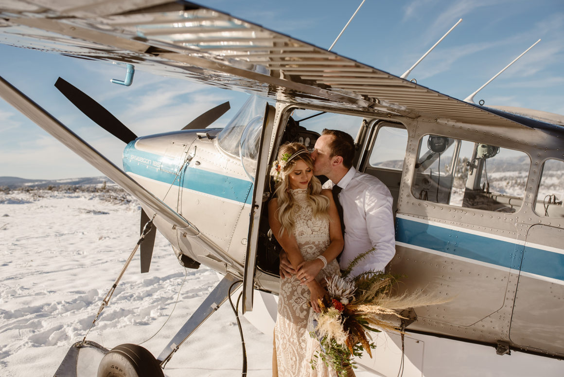 couple photo airplane in the snow