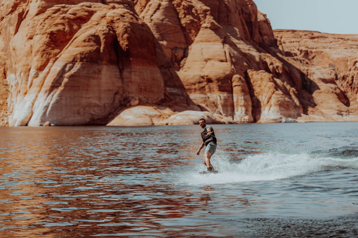 Guy wakeboarding on Lake Powell in Page Arizona